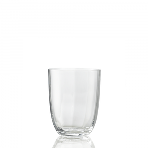 The Idra Tumbler Optic by Nason Moretti is a clear glass with smooth, optic-textured sides, centered on a white background and reflecting subtly at its base.