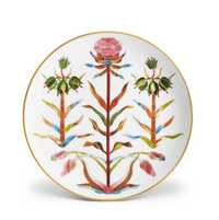 Handcrafted in Portugal, this L’Objet Grand Tour Dinnerware white porcelain plate features a 24k gold rim and a symmetrical, colorful floral design in the center.