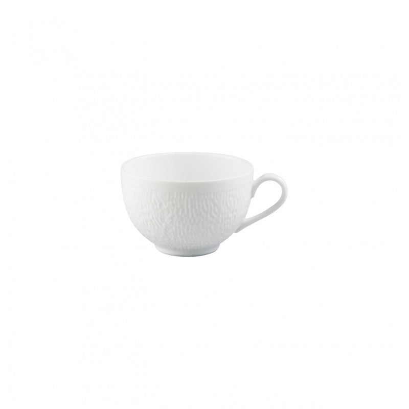 A Raynaud Mineral Dinnerware Glazed White teacup, featuring a subtle textured pattern and small handle, is displayed against a white background.