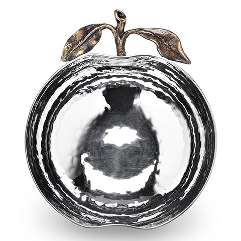 Introducing the Pomona Apple Bowl by Mary Jurek—a gleaming, silver bowl shaped like an apple, featuring a beautifully hammered texture and finished with elegant gold stem and leaf accents on top. Ideal as a festive serving piece for your Rosh Hashanah table, its reflective surface casts captivating patterns of light and shadow.