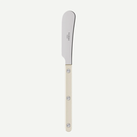 The Sabre Bistrot Pearly Butter Spreader - Pearl features a silver blade and a cream-colored handle accented by three metal rivets, shown on a plain white background.