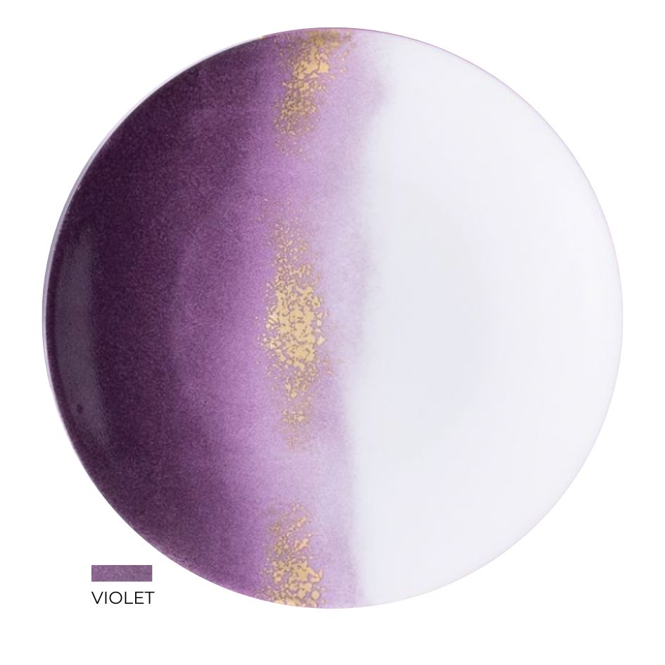 The Marie Daâge Horizon Gold Dinnerware features a round, hand-painted porcelain plate with a gradient from deep violet to white and a gold-speckled stripe, plus the "VIOLET" label and color swatch in the bottom left corner. Brand: Marie Daâge.