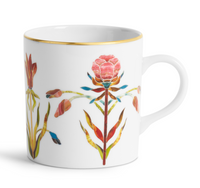 Grand Tour Dinnerware white porcelain mug featuring colorful botanical illustrations and a 24k gold rim.