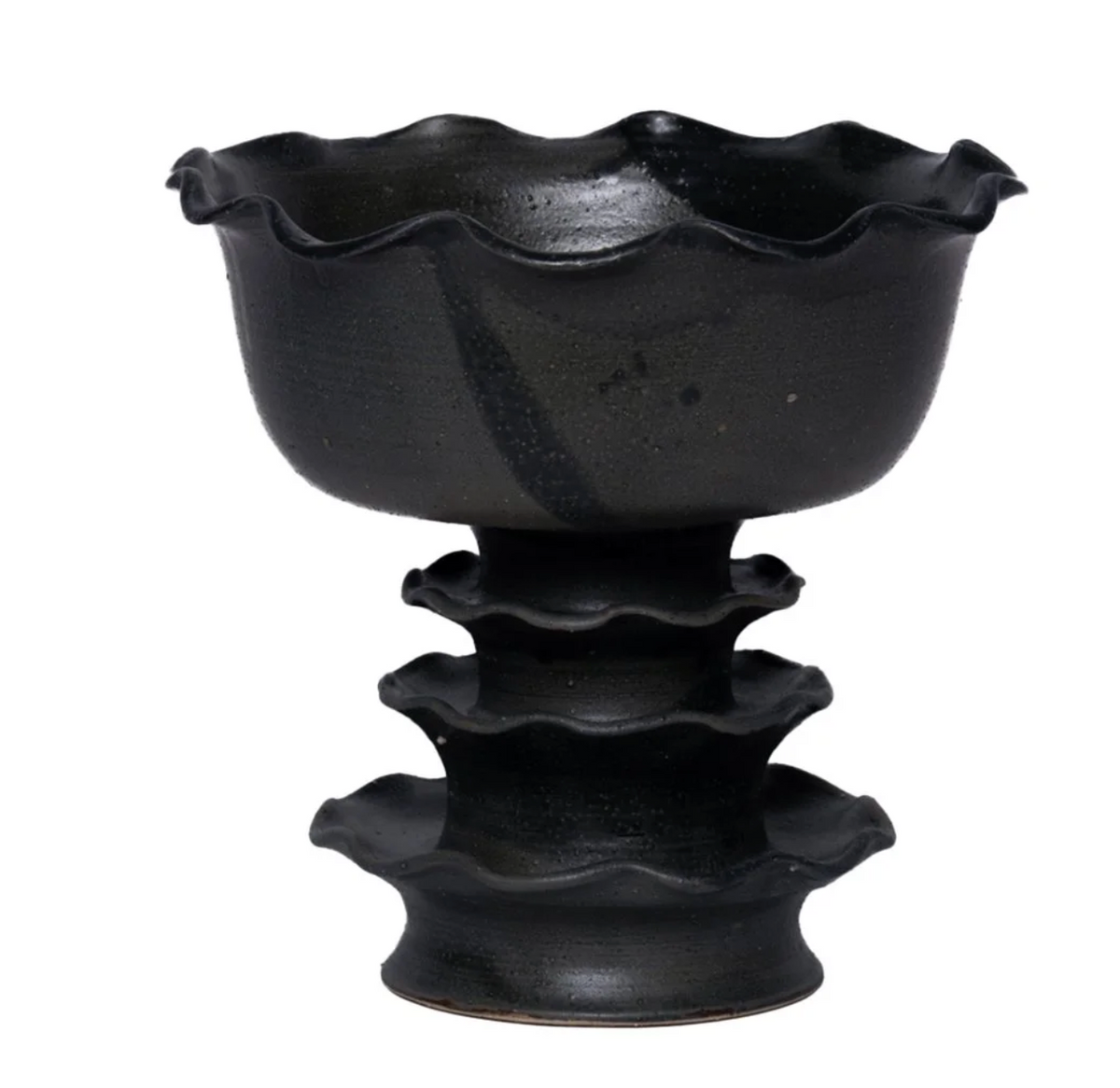 A Laguna-hued ceramic Leonora Pedestal Bowl by CDMX / MASA TALLER features a wavy-rimmed edge and rests atop a matching three-tiered pedestal of undulating, ruffled shapes, making this handcrafted piece a striking decorative addition to any space.