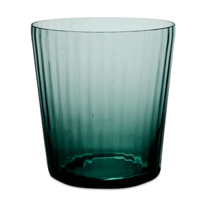 A Lando Pleat Glassware tumbler by MATCH, crafted from dark green transparent glass with vertical ridges, stands against a plain white background, its elegant form reflecting the artistry of antique Italian glass made using traditional Venetian techniques.