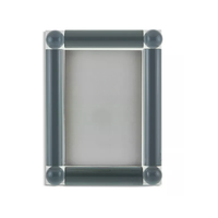 The Tizo Corner Ball Crystal Frame Grey features thick, dark grey cylindrical sides and round corner accents, creating an elegant way to display your favorite 5x7 photos.