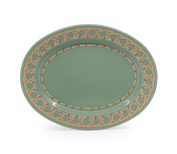 The Domino Wicker Oval Tray in Sea Blue by Crow Canyon Home features a decorative, interwoven gold pattern around the rim and a plain center, combining elegance and classic style in a small, oval design.