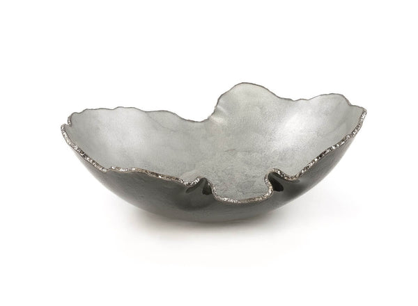The Gardeco Mapa Grey & Silver Trim Bowl features a sculpted metallic design with an uneven, wavy rim and a textured silver-gray surface, reminiscent of artisan glassware, presented against a white background.