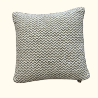 The Chevron Pillow Sage 22 x 22 by Threads Soft Goods features a gray, white, and sage green geometric design for a stylish accent.
