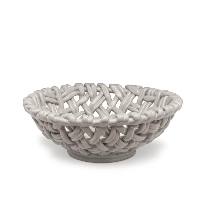 The Skyros Woven Basket - Round-15" is a glossy, light gray ceramic bowl with an open lattice design, resembling a handwoven basket, displayed on a plain white background.