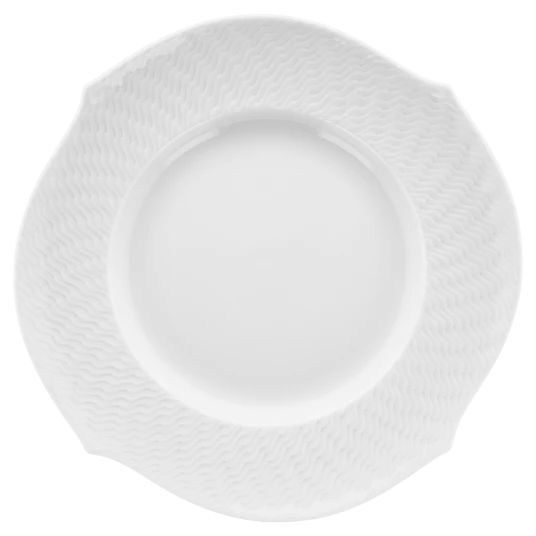 A white ceramic plate from the Meissen brand’s Waves Relief collection, featuring a textured, wavy pattern along the rim and viewed from above on a plain background—this piece exemplifies modern dinnerware with its distinctive design.