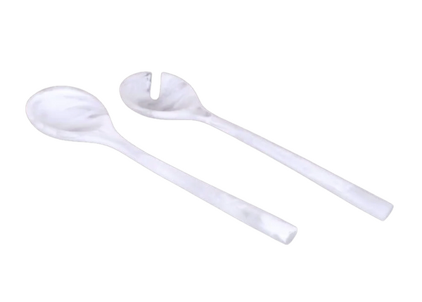 A solid white salad spoon and a slotted salad fork from the Dawn Resin Swirl Salad Servers - White set, both featuring a marbled pattern.