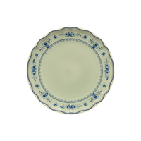 Vila Olive / Blue round ceramic plate with a scalloped edge and a blue floral pattern along the rim.