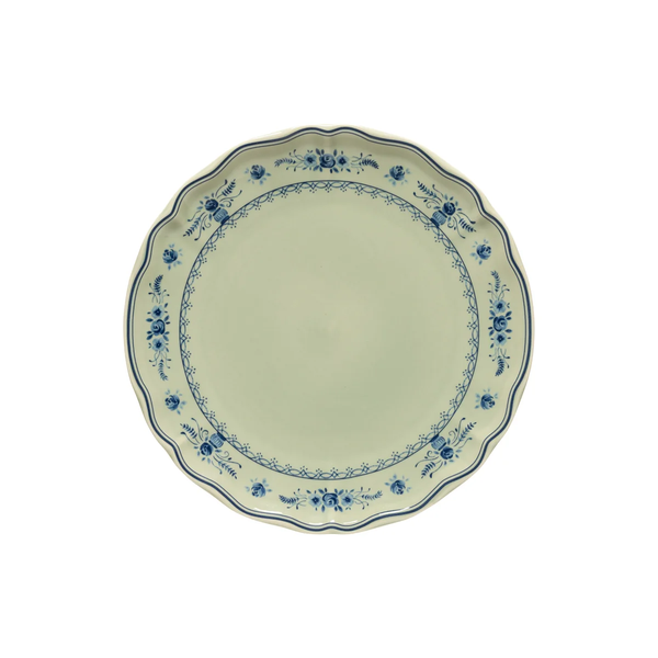 Vila Olive / Blue round ceramic plate with a scalloped edge and a blue floral pattern along the rim.