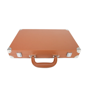 The Brouk & Co Excelsior Backgammon Set comes in a vintage-style brown vegan leather briefcase with silver hardware and a leather handle, perfect for carrying to game night. Shown isolated on a white background.