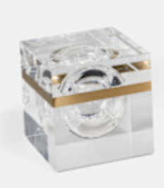 The Gemma Box by Luho is a clear acrylic decorative box with a gold horizontal stripe and a round lens in the center—perfect as a modern luxury decor accent. Displayed on a light background.