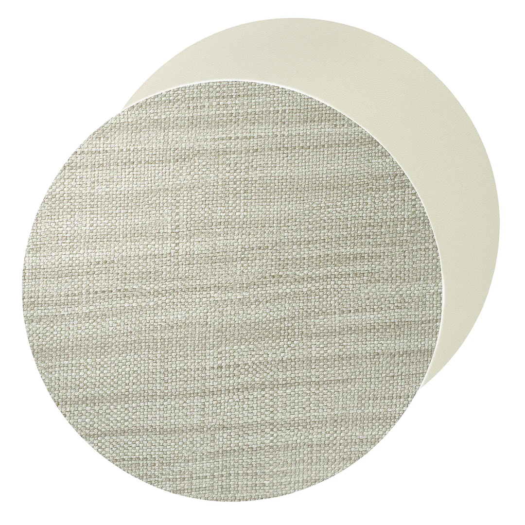The Bodrum Izmir Placemat Round s/4 set features two stacked mats: the top displays a textured, woven gray design, while the bottom placemat is smooth and plain in an off-white shade.