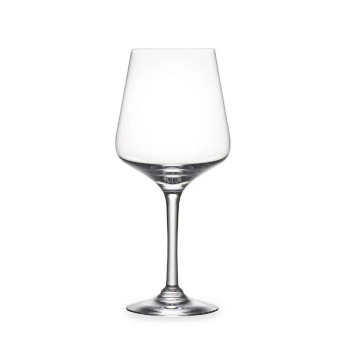A clear, empty wine glass with a long stem and wide bowl from the Simon Pearce Vintner Stemware collection is displayed against a plain white background.