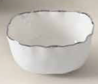 The PAMPA BAY Portofino Plata Bowl is a medium white porcelain serveware bowl with a scalloped rim and delicate silver trim, shown on a light surface.