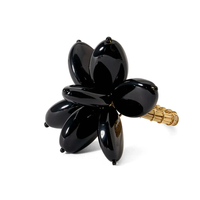 The Mod Stone Flower Napkin Ring Set of 4 by Deborah Rhodes brings a touch of elegant style to any table setting.