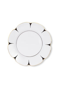 The Drops Dinnerware plate by Molecot features white Limoges porcelain in a flower shape with scalloped edges, black petal-like accents, and a slim gold-finished rim, shown against a white background.