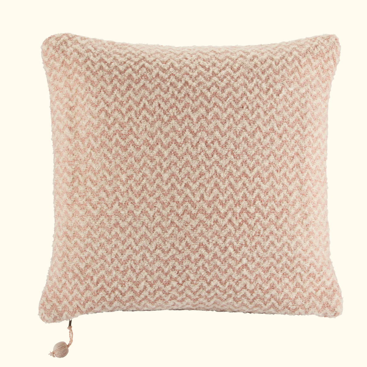 The Threads Soft Goods Chevron Pillow Light Pink 22 x 22 features a handwoven pink and white chevron pattern with a small corner tassel, displayed against a plain light background.