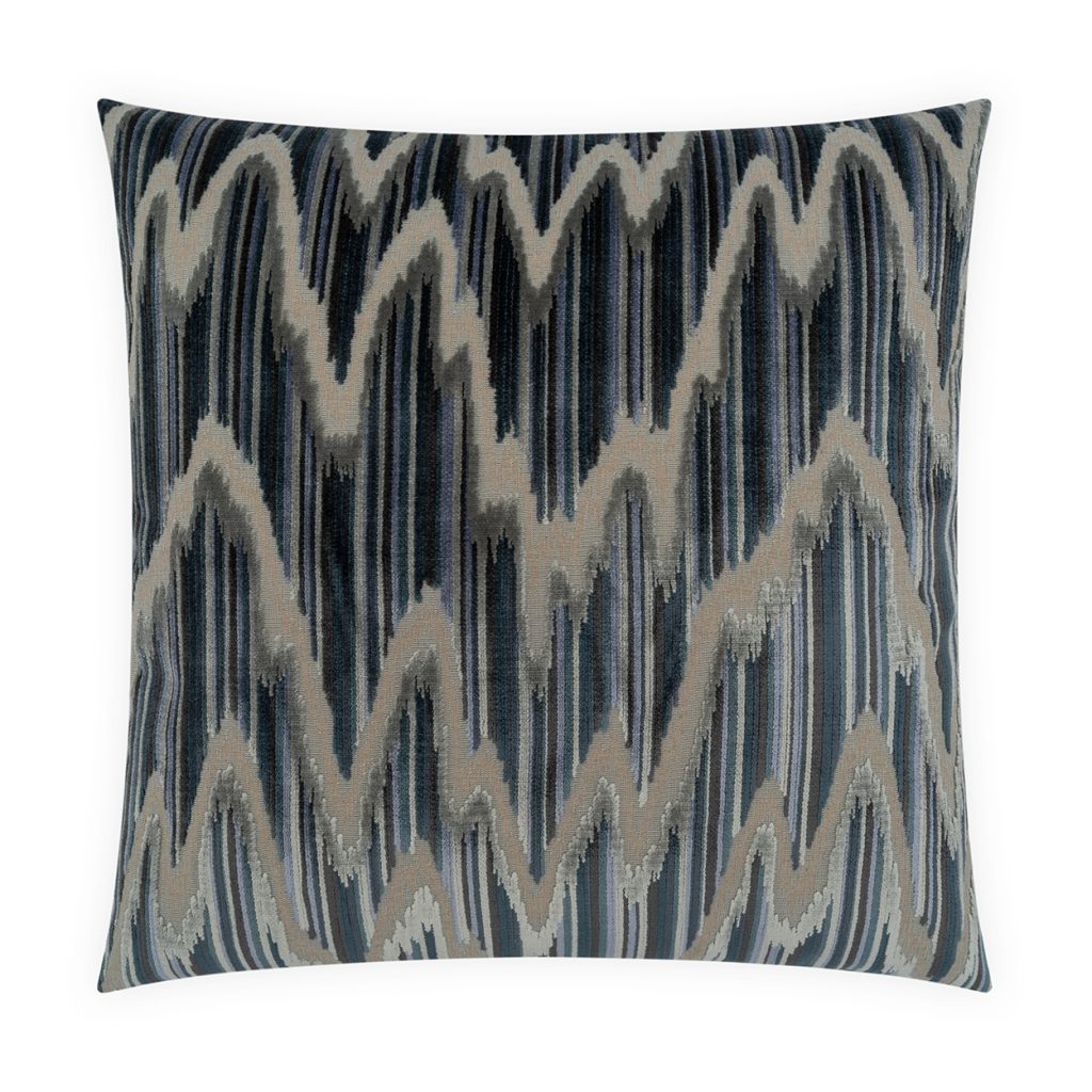 The Turin Pillow by D.V. KAP / Canaan Company is a 22x22 square velvet pillow showcasing a modern zigzag pattern in blue, gray, and beige tones. Vertical and diagonal lines form a dynamic wavy effect across the fabric, adding a sophisticated touch to your decor.