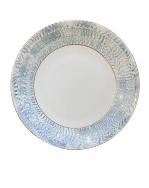 The Marie Daâge Agate Border plate by Marie Daâge features a round white ceramic design with a wide, textured blue and white patterned rim and a thin gold accent line, inspired by classic French dinnerware and shown on a white background.