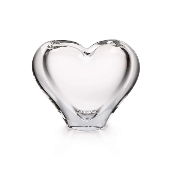The Simon Pearce Romance Vase - Large is a clear, smooth glass sculpture shaped like a heart, displayed against a plain white background.