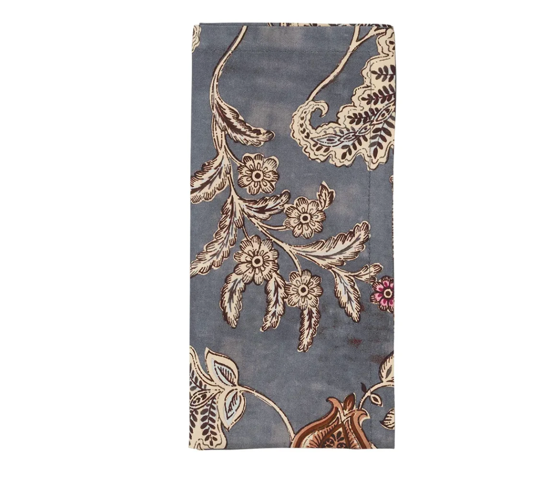 Folded blue Paisley Vine Napkin Set of 4 featuring a brown and cream paisley vine and floral pattern.