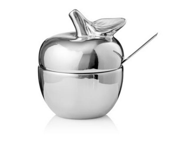 The Godinger Apple Honey Bowl w/ Spoon in silver features a shiny, apple-shaped design with a lid and attached spoon, displayed against a plain white background—an elegant choice for Rosh Hashanah holiday table decor.
