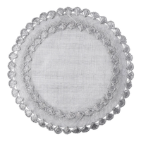 The Isadora Placemat Set of 4 by Juliska features round, light gray linen placemats with decorative scalloped edges and intricate embroidered patterns.