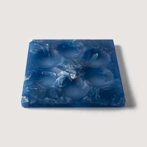 The Resin Seder Plate - NEW! by CDMX / BRUCI features a square blue and white marbled design with six indentations, handcrafted in Mexico—perfect for Passover 2025.