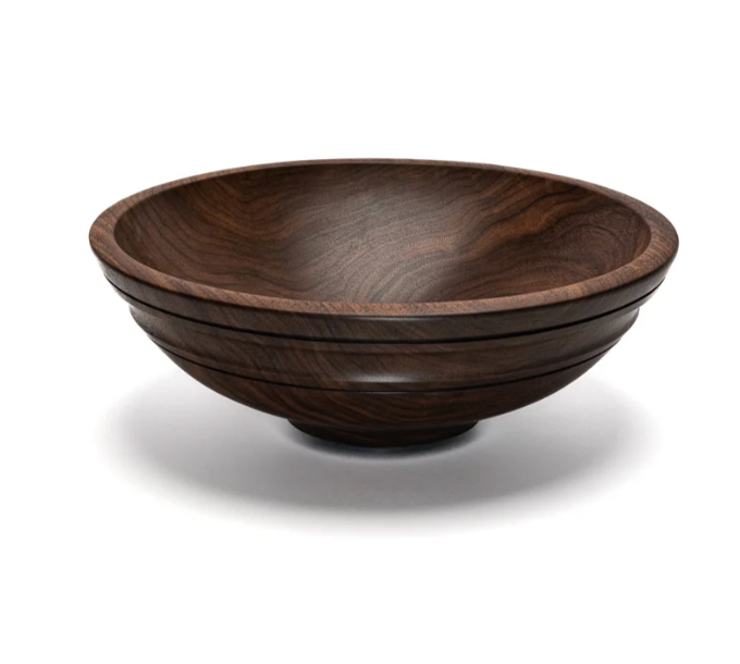 The Willoughby (Round with Ridge) Walnut Wooden Bowl Collection 12″ by Andrew Pearce is a round, dark wooden bowl featuring a smooth, polished finish and subtle carved ridges, shown against a white background.