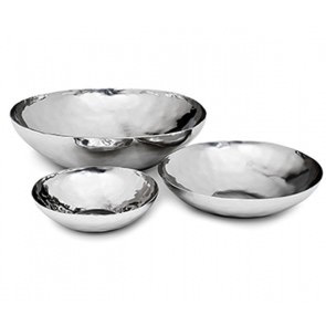 The Luna Serving Bowl 8" by Mary Jurek is a shiny, stainless steel bowl with a smooth, slightly hammered texture and rounded edges. Dishwasher safe for easy cleaning, it combines elegance with practicality.