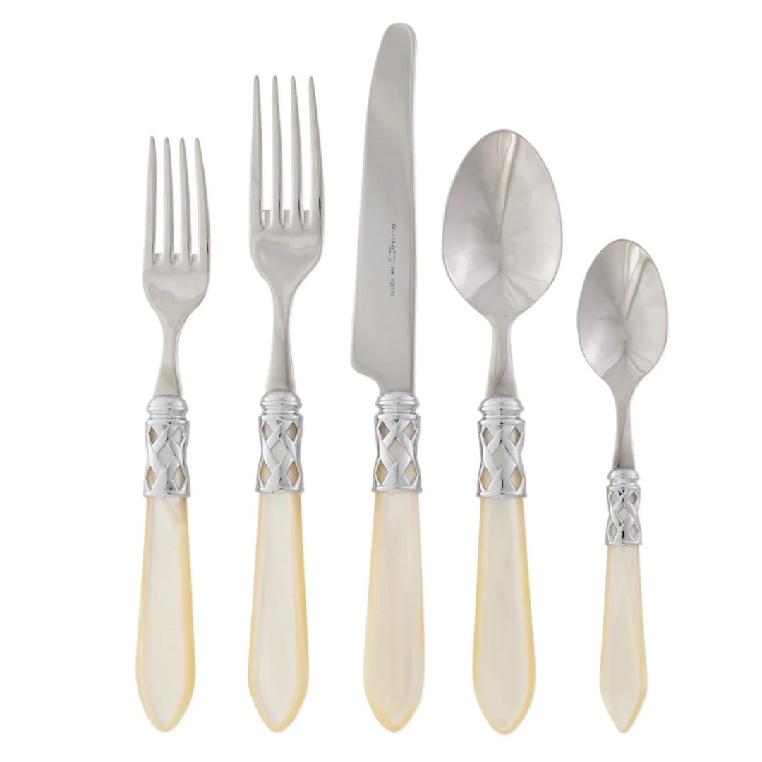 Ivory handle and stainless steel Aladdin flatware.