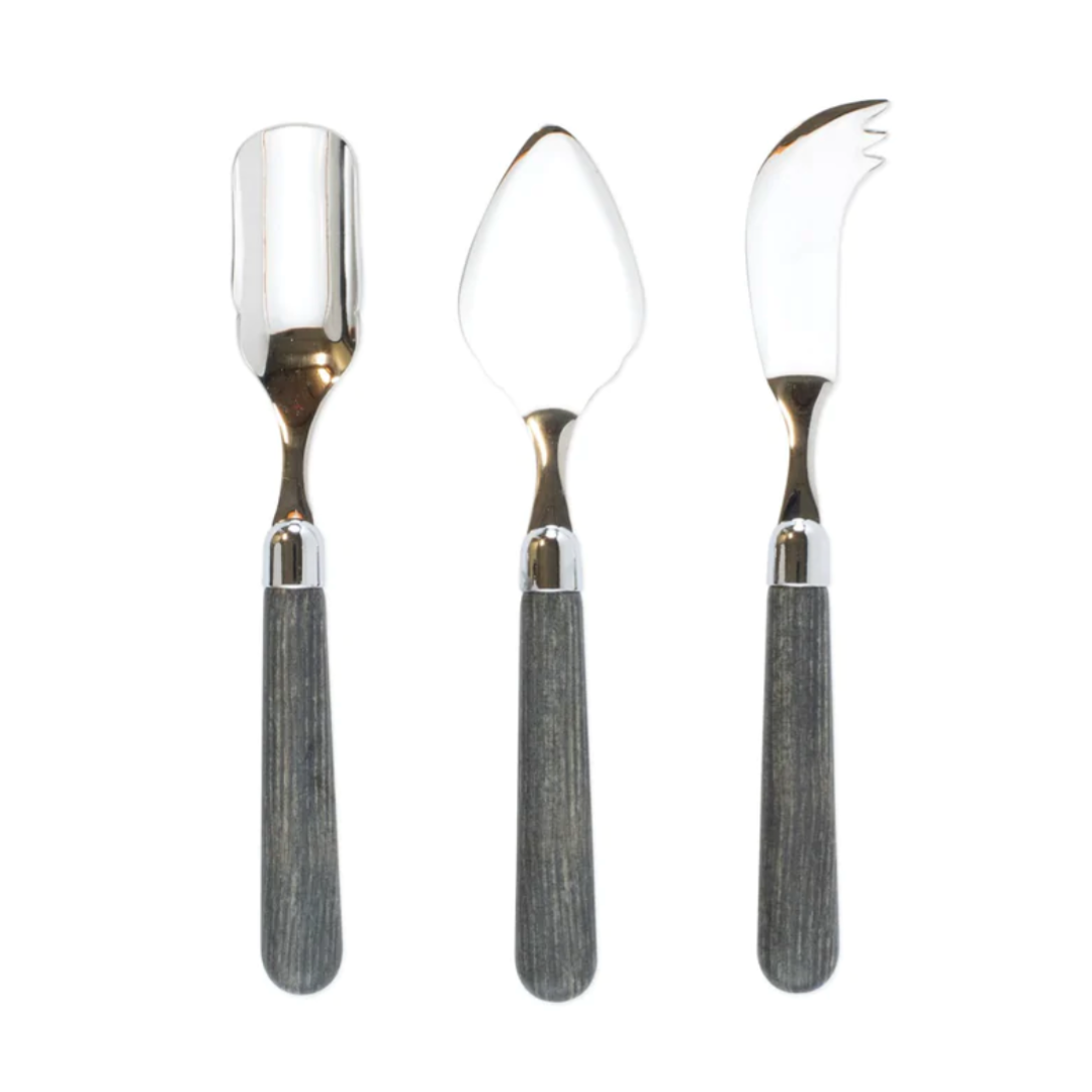 The Albero Cheese Knife Set is made of stainless steel with wood handles. 