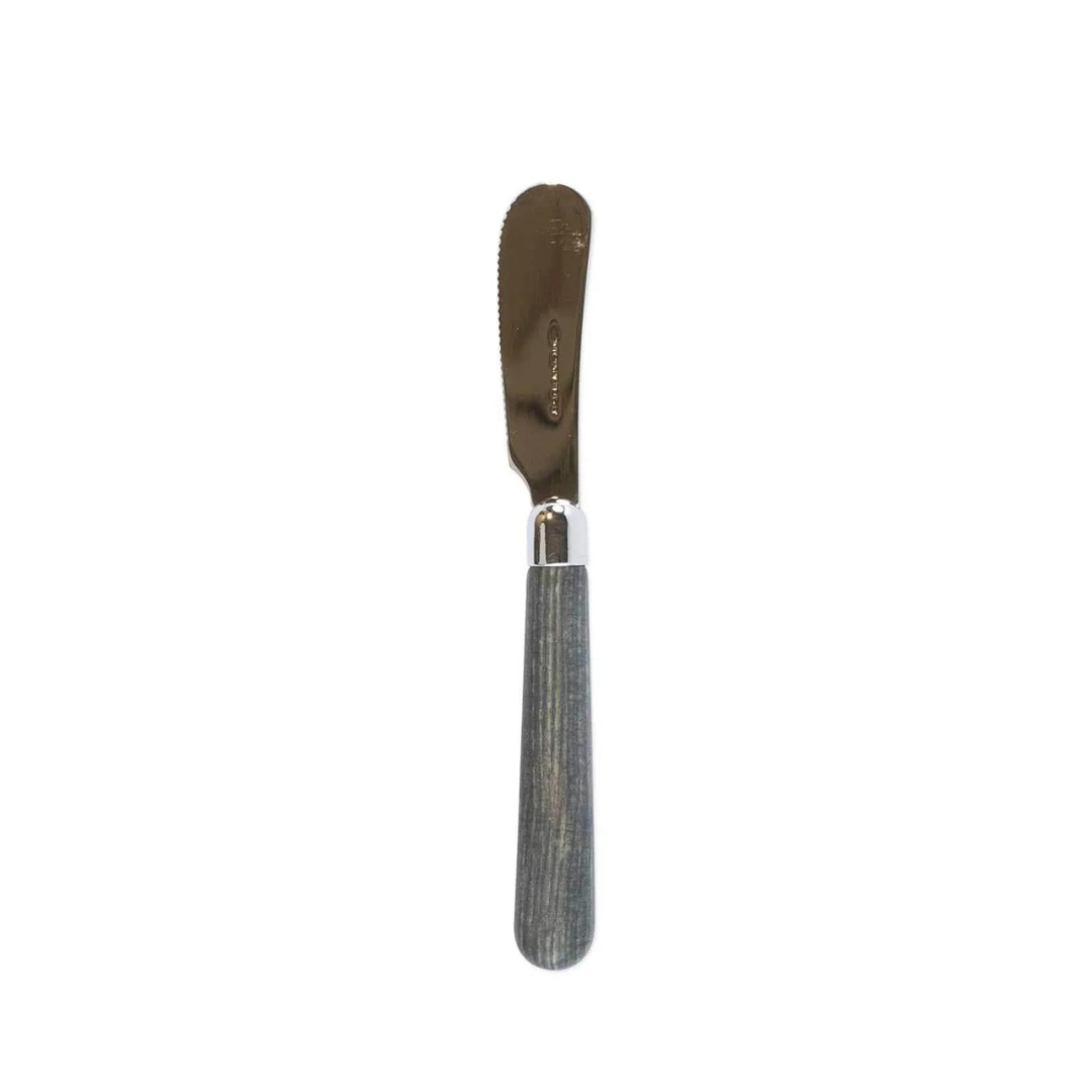 The albero spreader is made of stainless steel and has a grey elm acrylic wood handle.