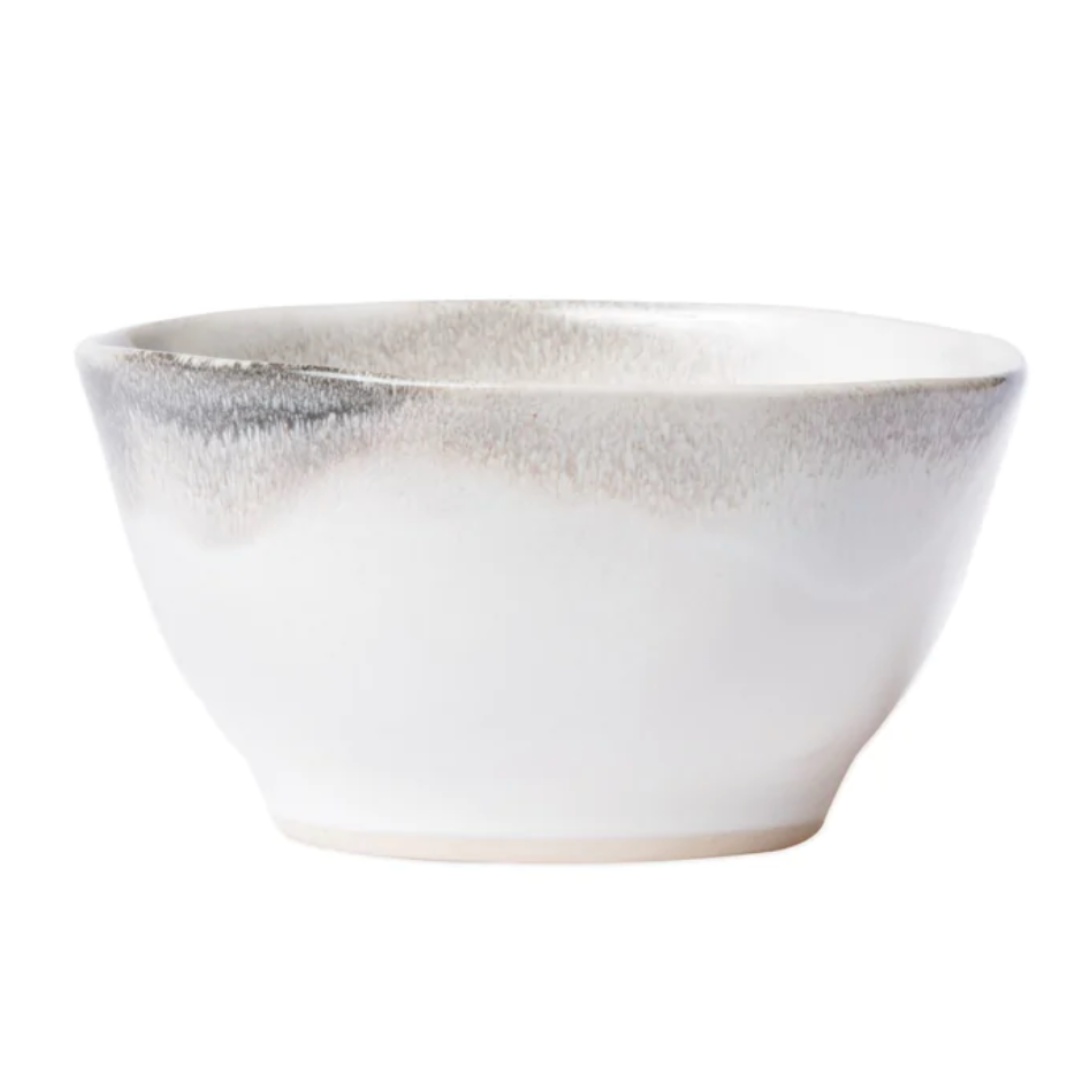 This salad bowl is made of stoneware and features an ash like design.
