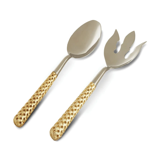 The Braid Serving Set Gold L'Objet by L'Objet features two silver utensils—a large spoon and a fork with three decorative tines—each with wide, 24k gold-plated woven handles, displayed side by side on a white background.