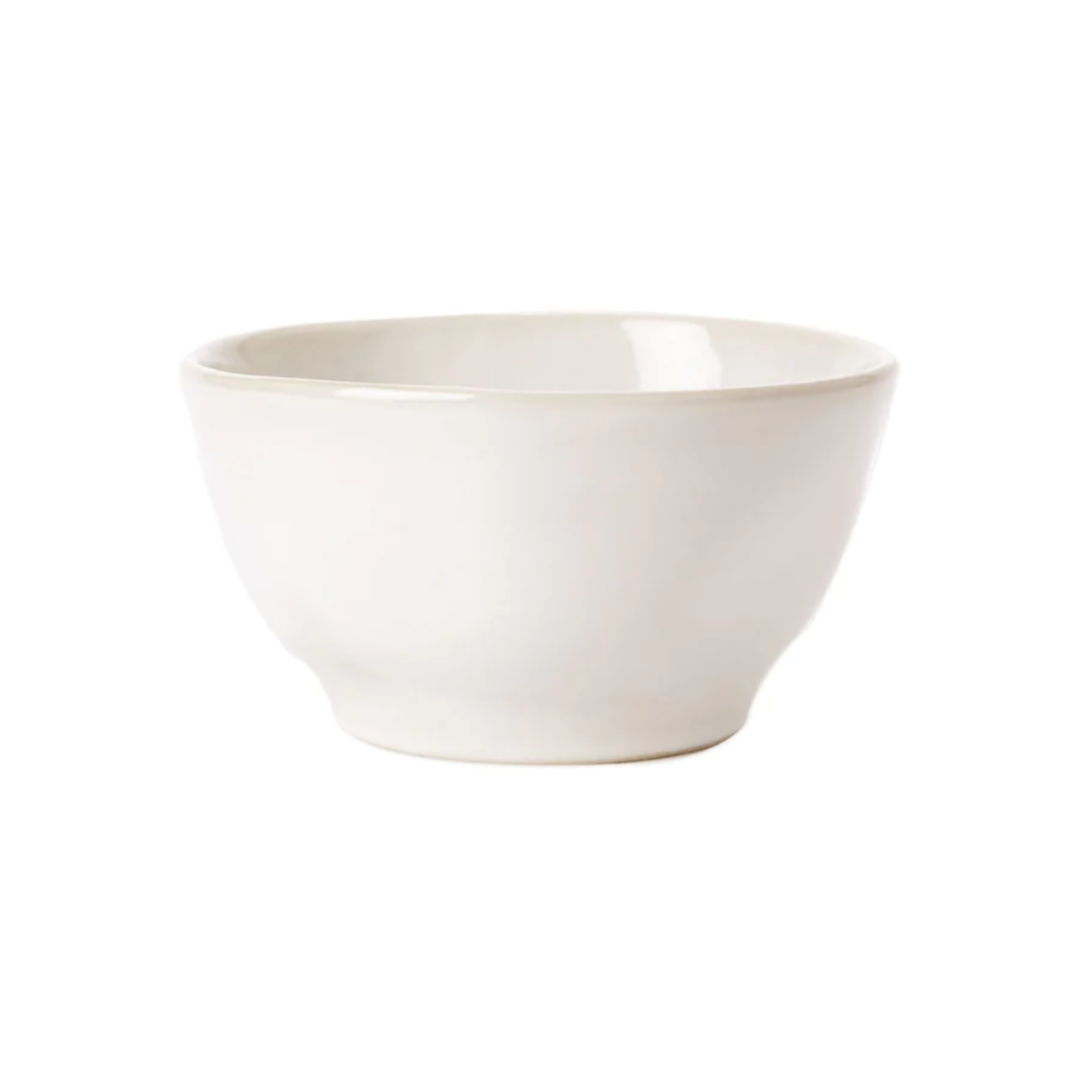 This cereal bowl features a unique organic texture. Made in white stoneware. 