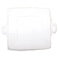 This white square platter features comfortable handles is white in color and made of fine italian stoneware. 