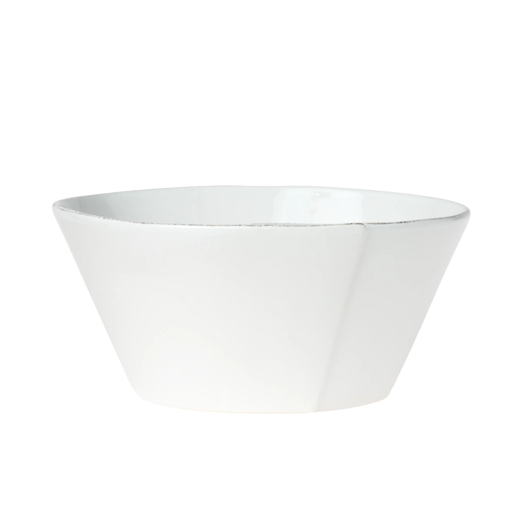 The medium stacking bowl is made of durable and timeless stoneware. This bowl is white. 