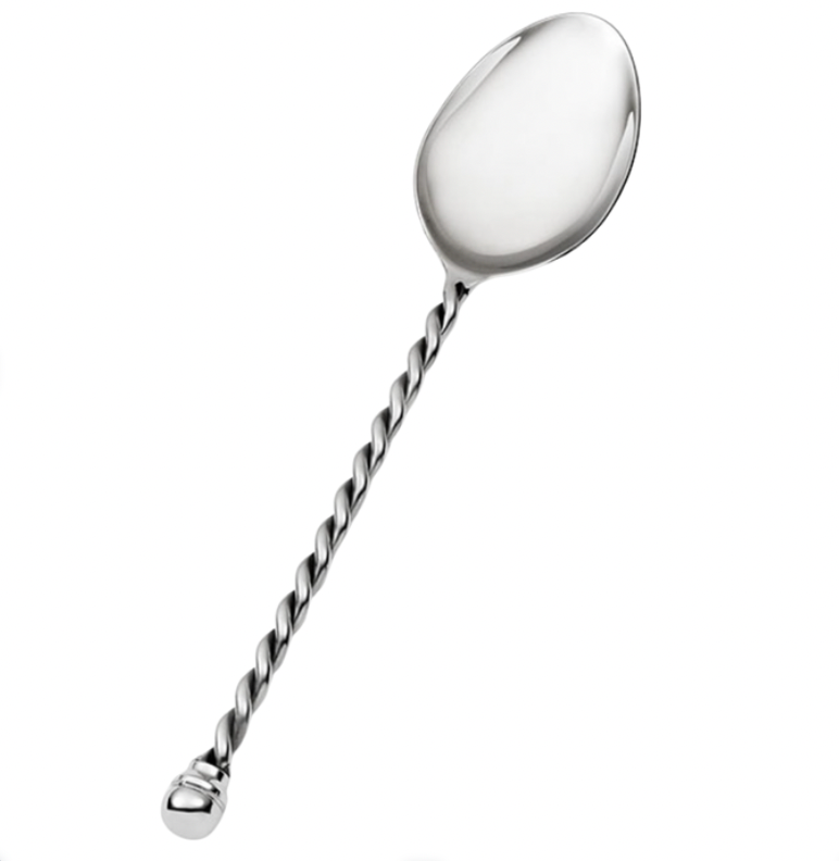 Introducing the Paloma Vegetable Spoon by Mary Jurek—a shiny stainless steel serving spoon featuring a smooth, rounded bowl and a distinctive braided handle. The handle is finished with an elegant, knob-like tip, creating a sophisticated utensil perfect for serving vegetables at any table setting.