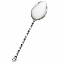 Introducing the Paloma Vegetable Spoon by Mary Jurek—a shiny stainless steel serving spoon featuring a smooth, rounded bowl and a distinctive braided handle. The handle is finished with an elegant, knob-like tip, creating a sophisticated utensil perfect for serving vegetables at any table setting.