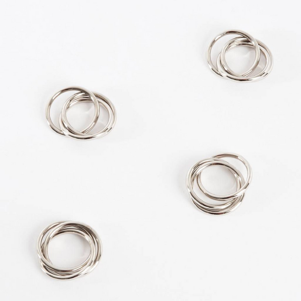 Silver metal triple ring napkin ring set. 