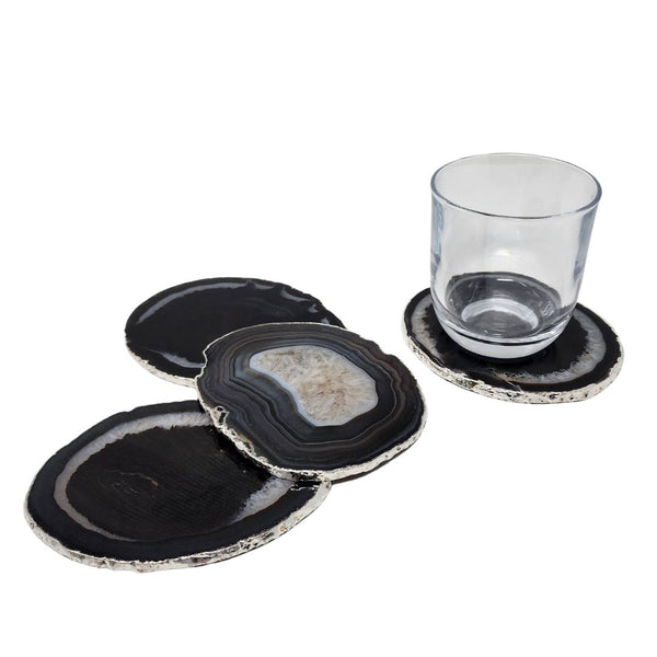 Black agate coasters with a silver trim.