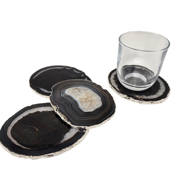 Black agate coasters set of four with a silver trim.