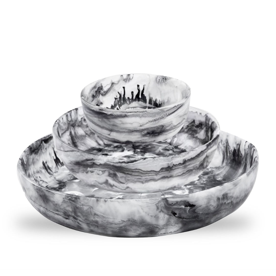 Large, medium, and small black swirl resin round bowls. 