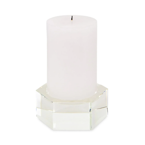 Made with crystal, this candleholder holds a white candle.